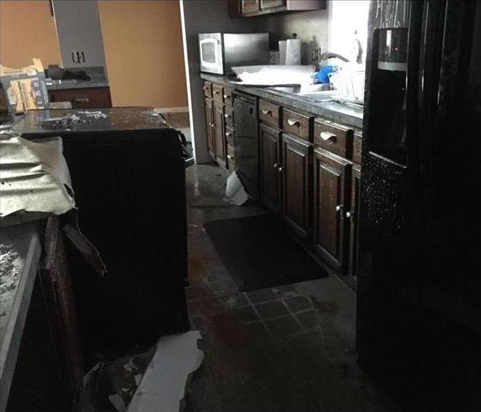 Kitchen suffered water damage, wet cabinets